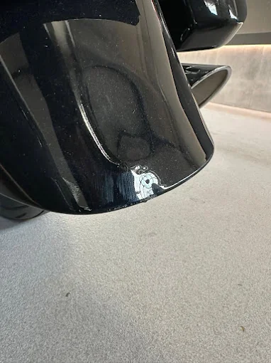 Motorcycle fuel tank dent before paintless dent repair
