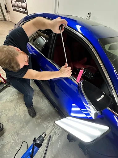 Paintless dent repair in progress at the Precision Dent Repair Burlington shop on Harvester Road