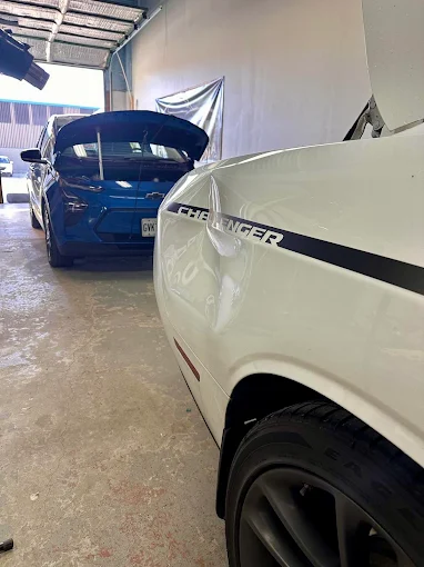 Dodge Challenger panel with dent damage before paintless dent repair