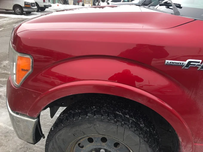 Ford F-150 Lariat bedside after paintless dent repair, no repaint required